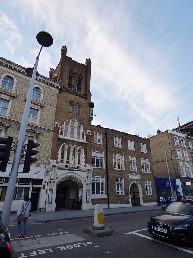 The brick and stone exterior of Our Lady of Dolours church in Chelsea, London.