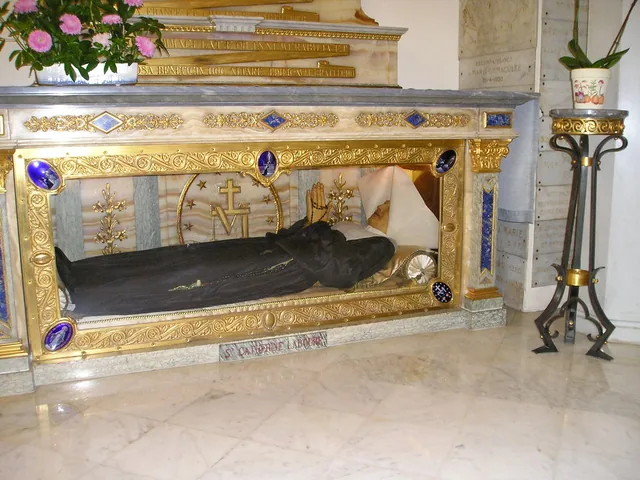 The vested reliquary display attributed to Catherine Labouré in the Chapel of the Miraculous Medal, Paris. Appearance alone cannot establish the material condition beneath the clothing or display surfaces.