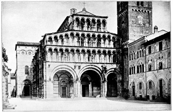 Historical black and white photograph of the arcaded facade of Lucca Cathedral.